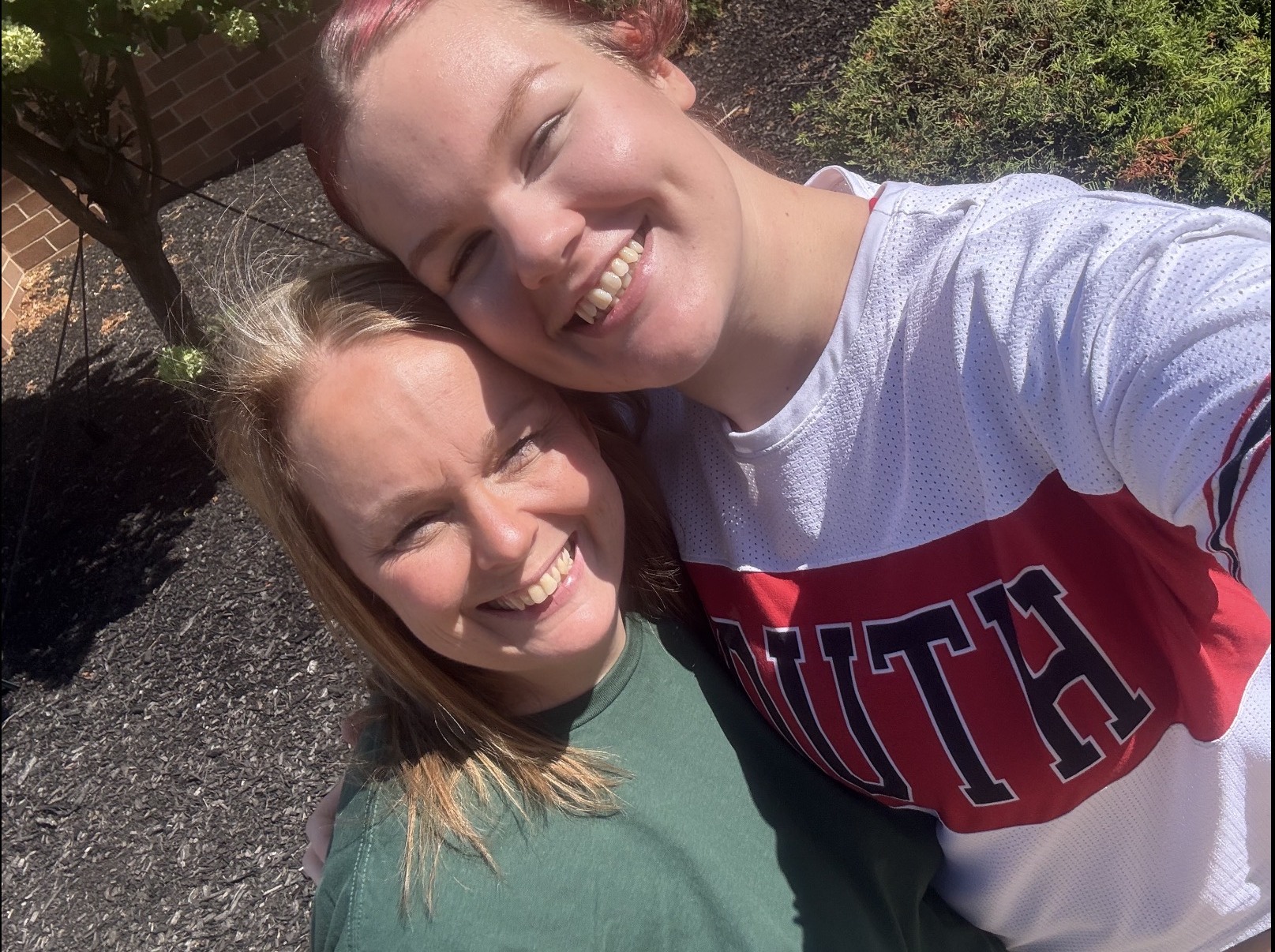 Samantha Cox with her daughter in a Fort Zumwalt South cheer uniform